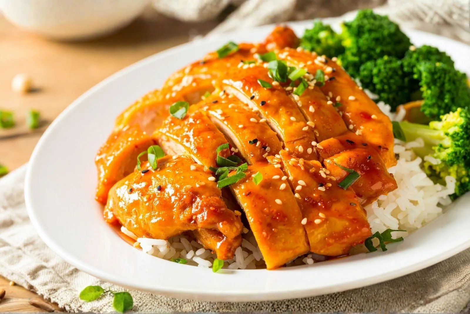 Teriyaki chicken breast served with steamed rice and broccoli at Fusan Dumpling House & Sushi, an Asian Fusion Restaurant in New York